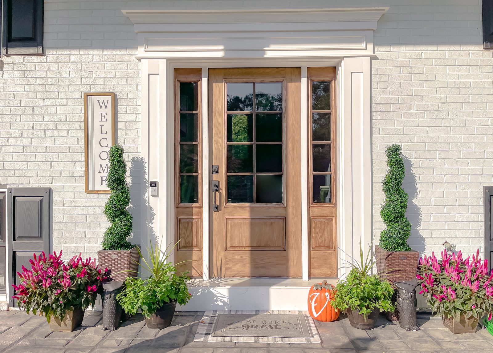 Renovated front entry with wood door at the Comanche Lane project