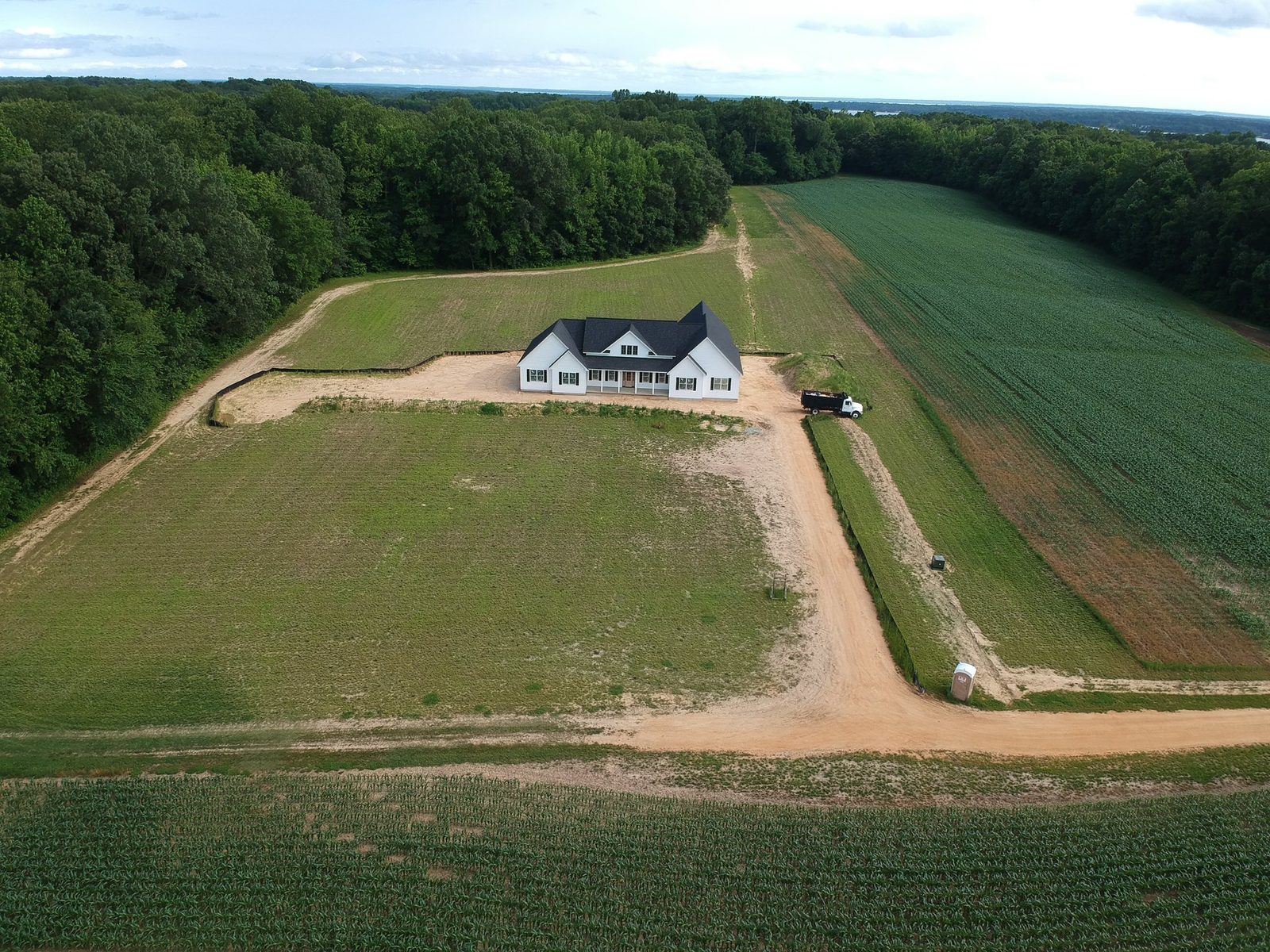 Aerial view of the Julia's Knoll custom farmhouse site in St. Mary's County MD